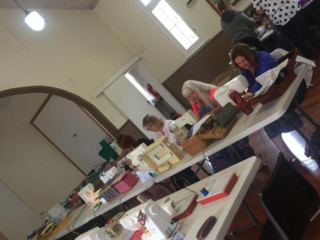 Creative Group & friends hard at it in the local hall, sewing up toiletry bags ...