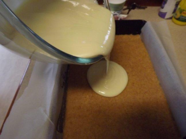 Pour over biscuit mixture that has been resting in slice tray in the fridge.